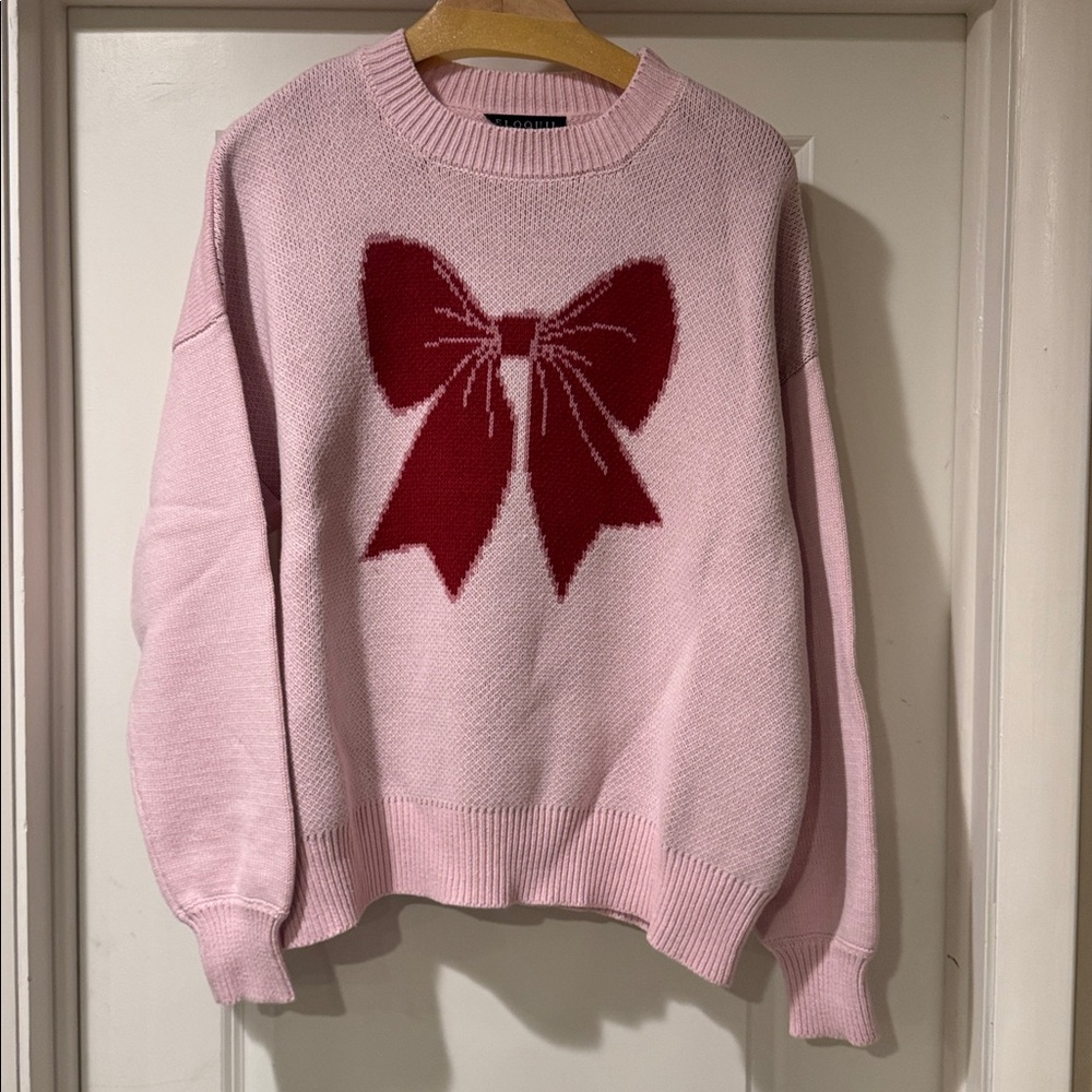 Pink Sweater with Red Bow Design